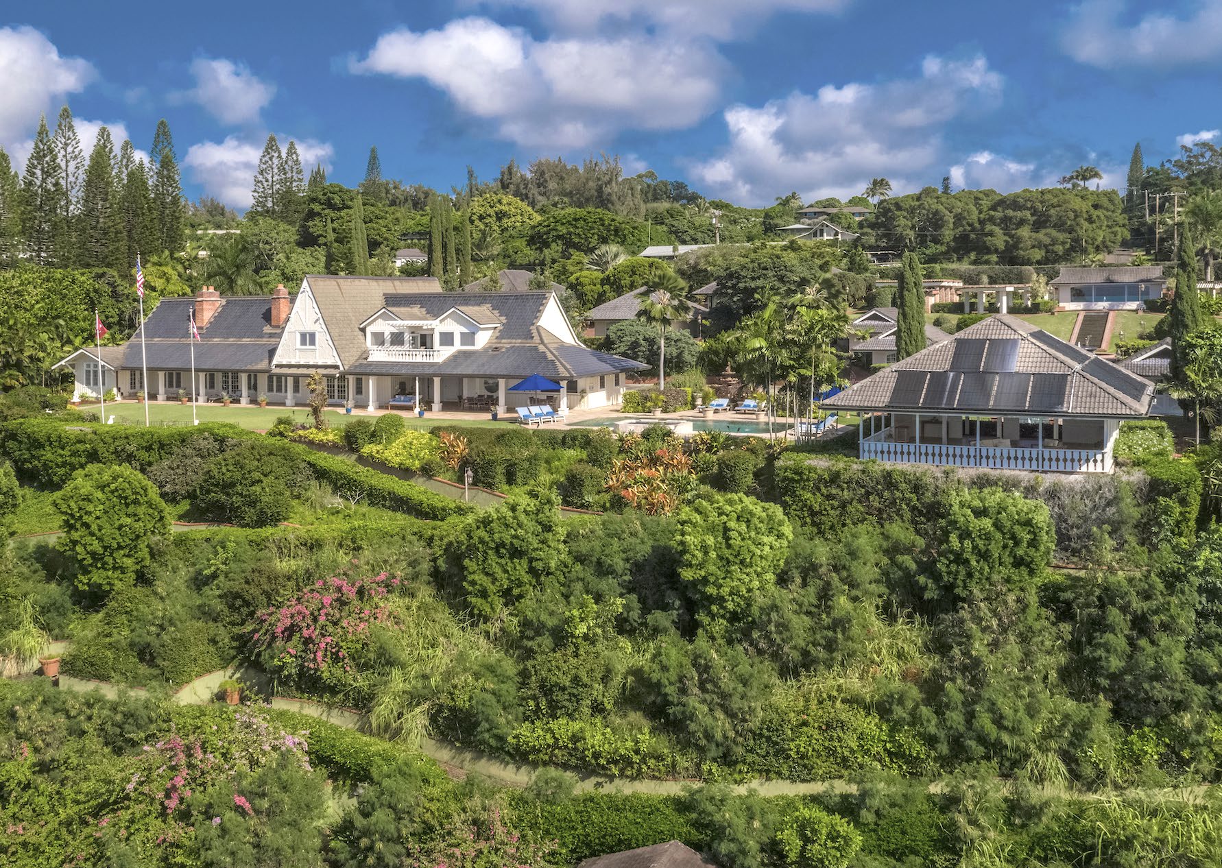 Estate with pool and guest pavilion surrounded by tropical gardens above the North Shore of Oahu in Haleiwa, Hawaii